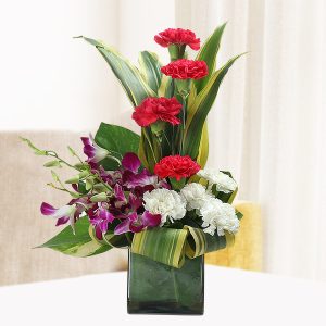Red & White Carnations with Orchids Glass Vase Arrangement