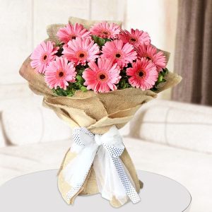 12 Pink Gerberas Hand Tied Jute Bouquet